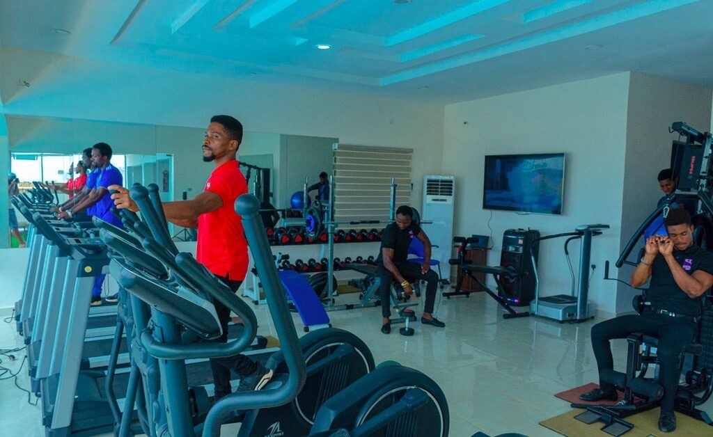 The fitness room at House 7, with treadmills and free weights.